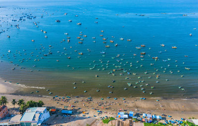 High angle view of crowd on sea shore