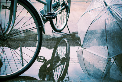 Close-up of bicycle on wet street