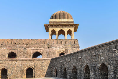 Low angle view of rani roopmati pavilion against clear blue sky