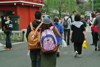 People looking at town on street