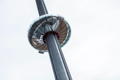 Low angle view of ferris wheel against clear sky