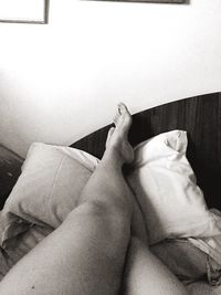 Low section of woman relaxing at home