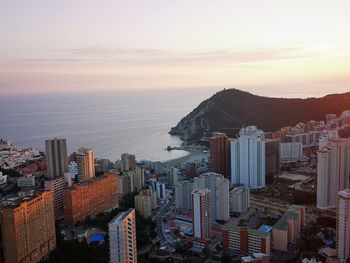 High angle view of buildings against sky during sunset