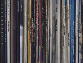 Close-up of vinyl records on a shelf