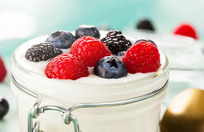 Close-up of fruits on yogurt