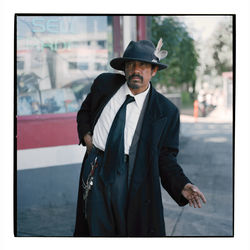 Portrait of man wearing hat standing outdoors