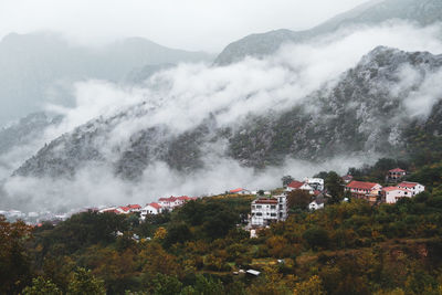 High angle view of trees and buildings against sky