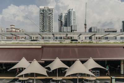 Buildings in city against sky