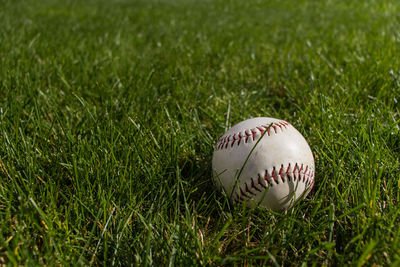 Close-up of baseball ball on field