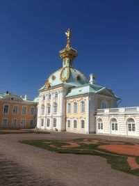 Low angle view of building against blue sky