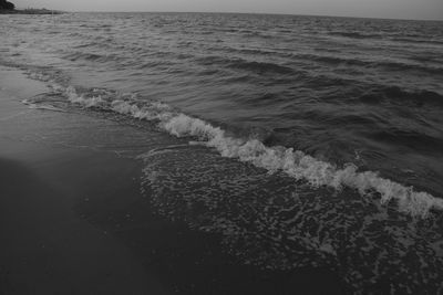 High angle view of waves rushing towards shore