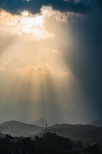 Scenic view of silhouette mountains against sky during sunset