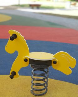 Close-up of yellow toy on table