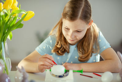 Close-up of girl painting