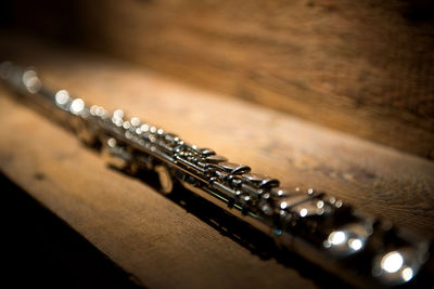 Close-up of wind instrument on table