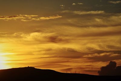 Low angle view of dramatic sky during sunset