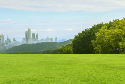 Scenic view of landscape against cloudy sky