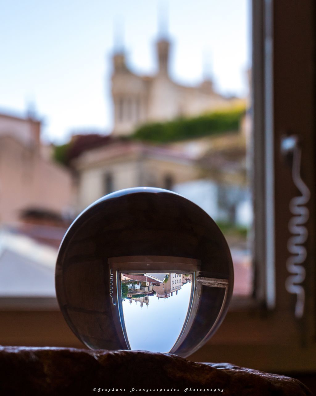 CLOSE-UP OF REFLECTION OF BUILDING