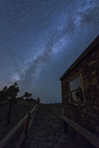 Low angle view of building against sky at night