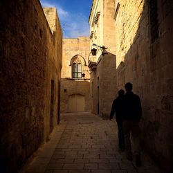 People walking in alley