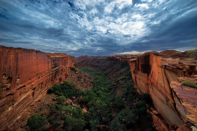 Scenic view of rock formations at kings canyon against cloudy sky