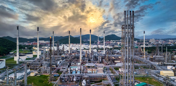 Oil and gas refinery plant and storage tank form industry zone with blu sky background, oil and gas