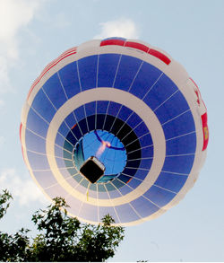 Low angle view of air hot balloon against sky