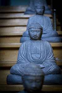 Statue of buddha against building