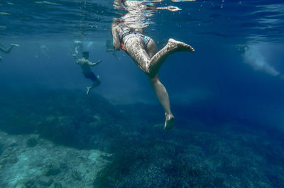 Man and woman snorkeling undersea