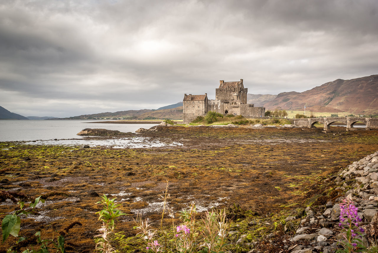 VIEW OF CASTLE AGAINST CLOUDY SKY