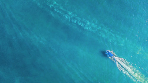 High angle view of people swimming in sea