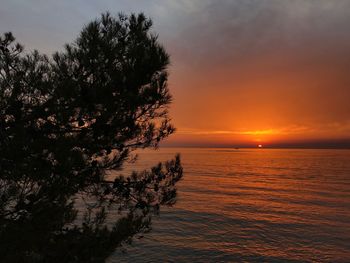 Scenic view of sea against sky at sunset