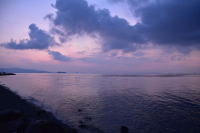 Scenic view of sea against sky at sunset