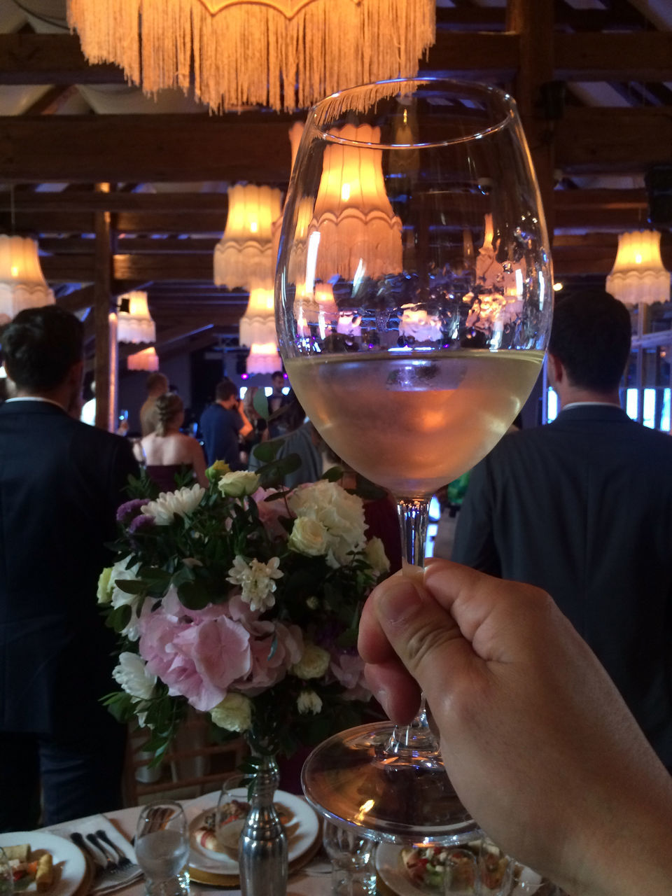 PEOPLE HOLDING GLASS OF RESTAURANT