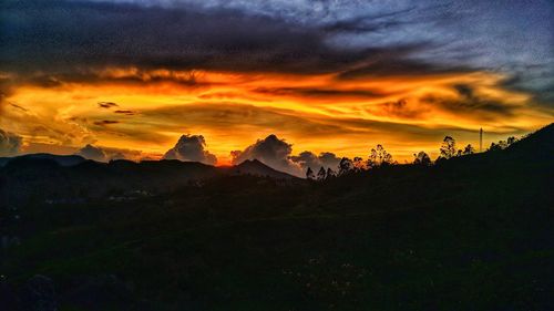 Scenic view of dramatic sky during sunset