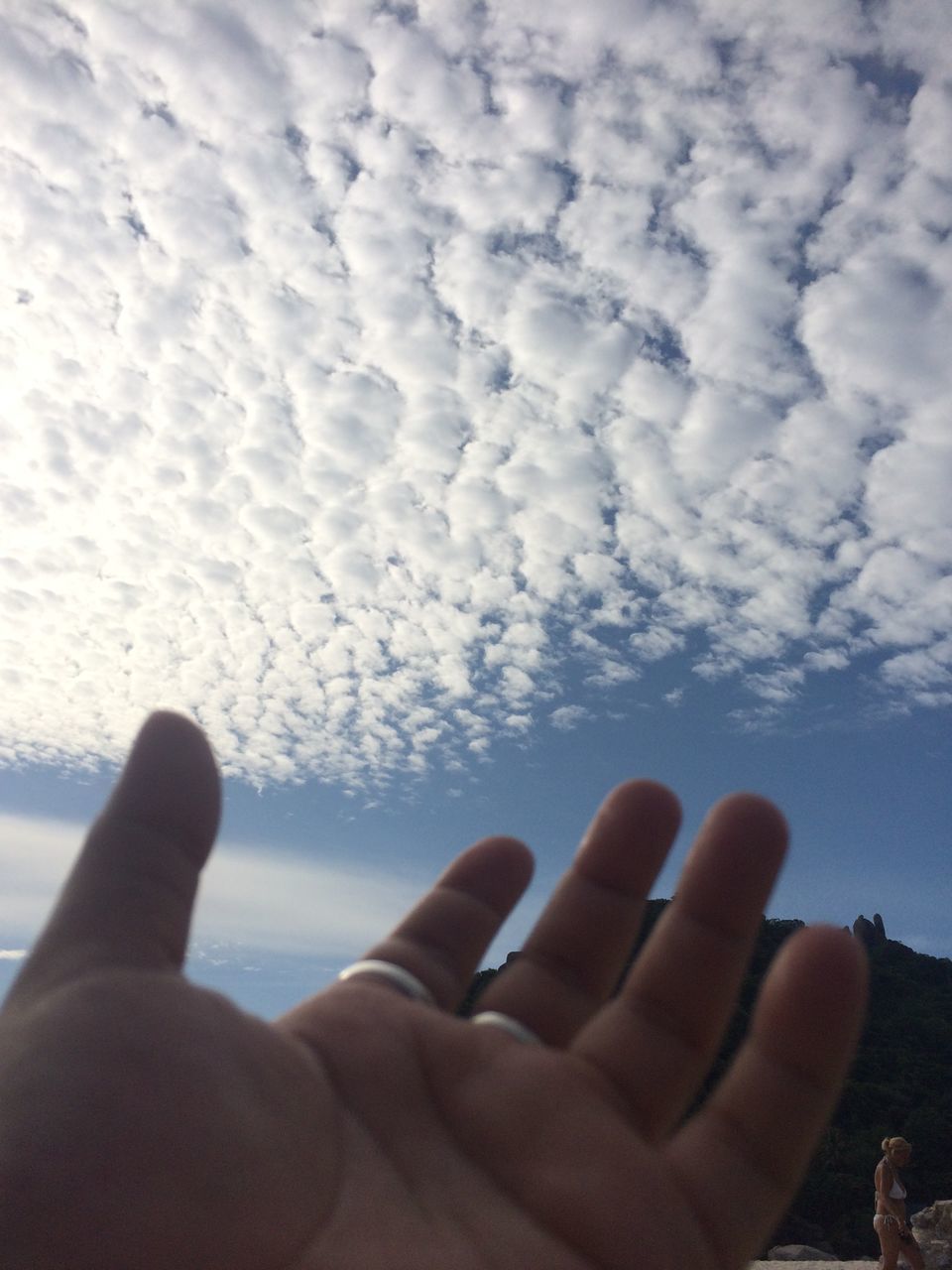sky, part of, person, lifestyles, leisure activity, cropped, cloud - sky, holding, men, water, blue, cloud, personal perspective, unrecognizable person, day, low section