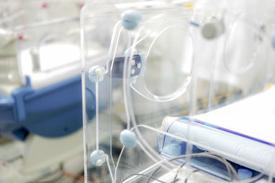 Newborn baby in hospital incubator