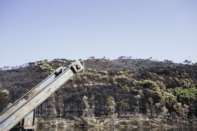 Built structure on landscape against clear sky