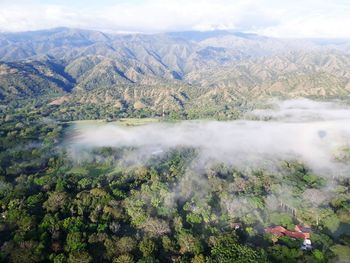 Scenic view of tree mountains against sky