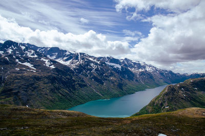 Scenic view of snowcapped mountains against sky