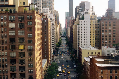 High angle view of street amidst buildings in city