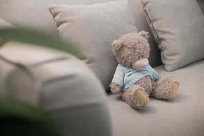 High angle view of baby relaxing on bed at home