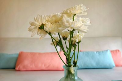 Close-up of white flower vase on table at home