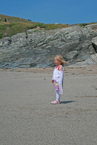 Full length of woman walking on beach