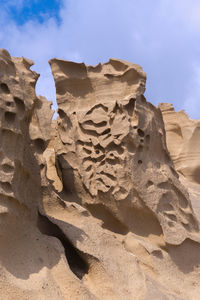 Low angle view of sand dune