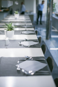 Empty tables and chairs in restaurant