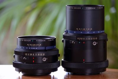 Close-up of camera lens on table