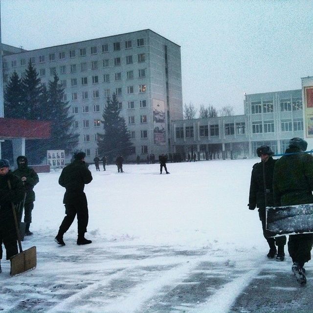 winter, snow, cold temperature, season, building exterior, weather, architecture, built structure, full length, walking, men, lifestyles, covering, city, warm clothing, leisure activity, frozen, city life