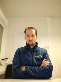 Portrait of young man sitting at home