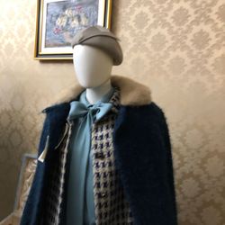 Close-up of electric lamp hanging on wall at home